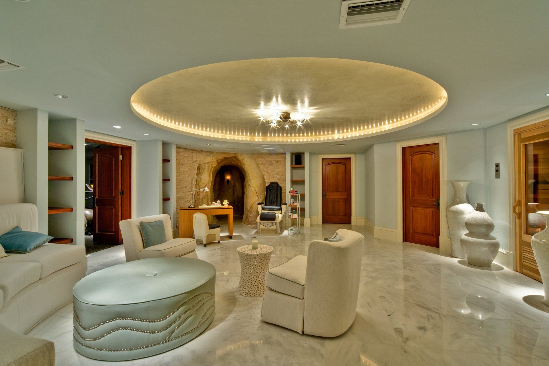 a living room filled with furniture and a circular ceiling