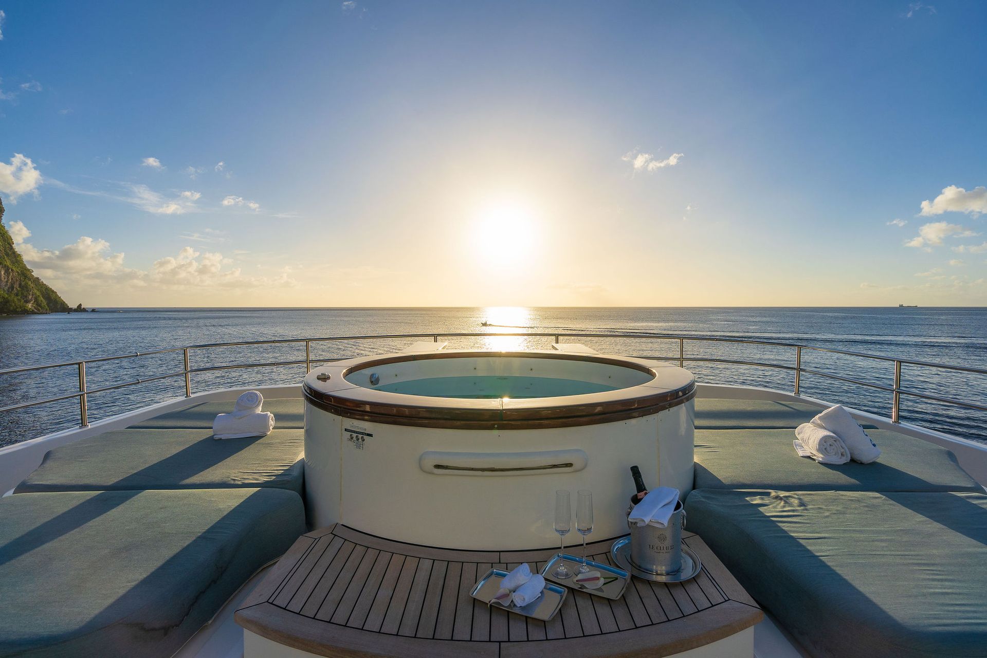 there is a hot tub on the deck of a boat in the ocean