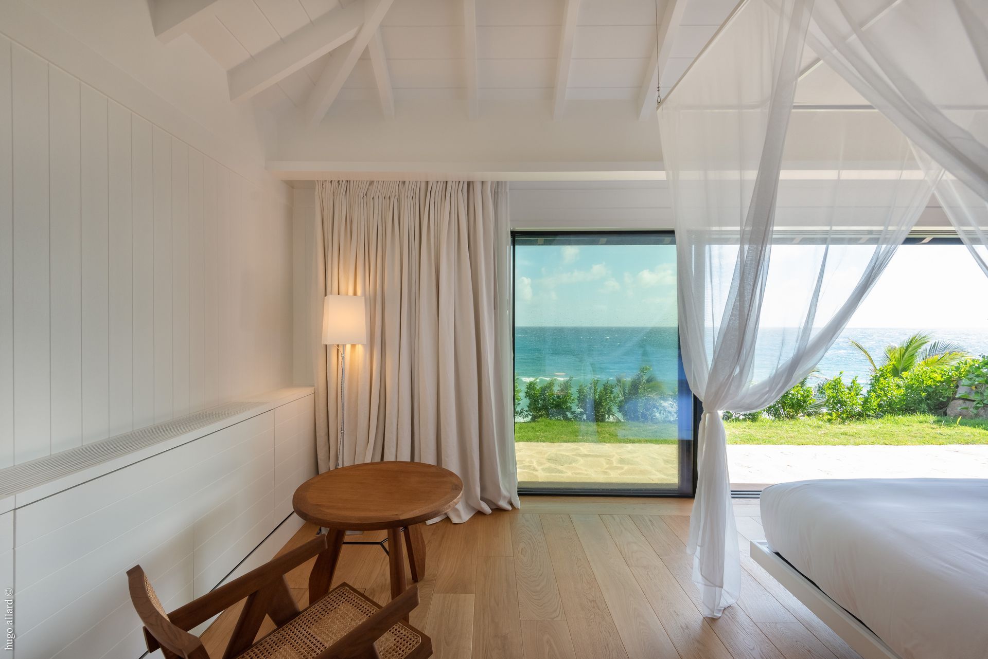 a bedroom with a canopy bed and a table