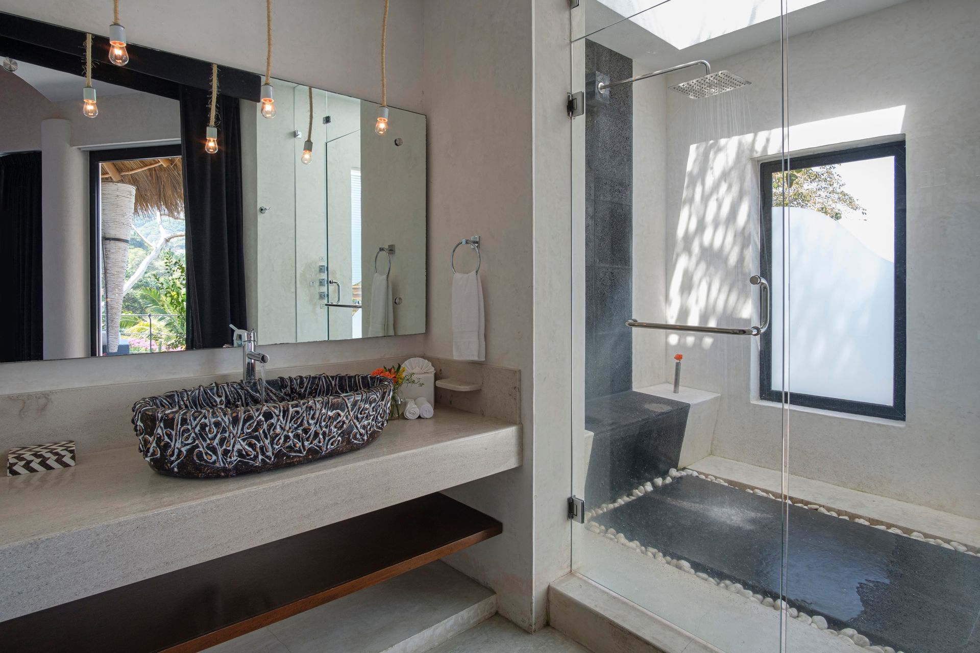 a bathroom with a sink, mirror, tub and shower
