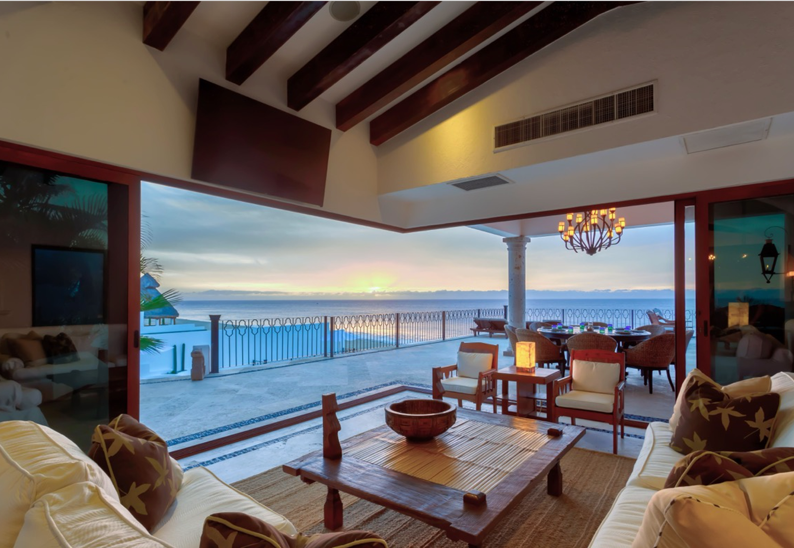 a living room with a view of the ocean