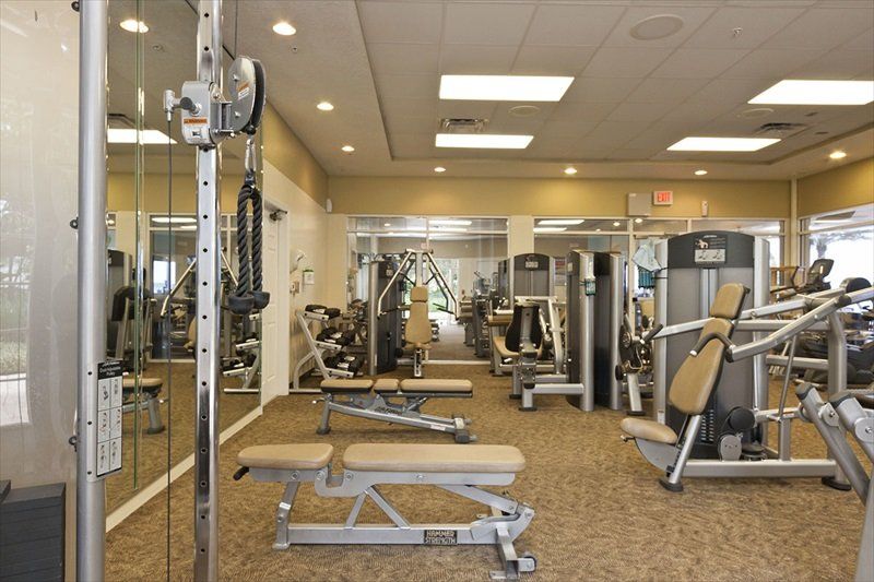 a large gym with a lot of exercise equipment