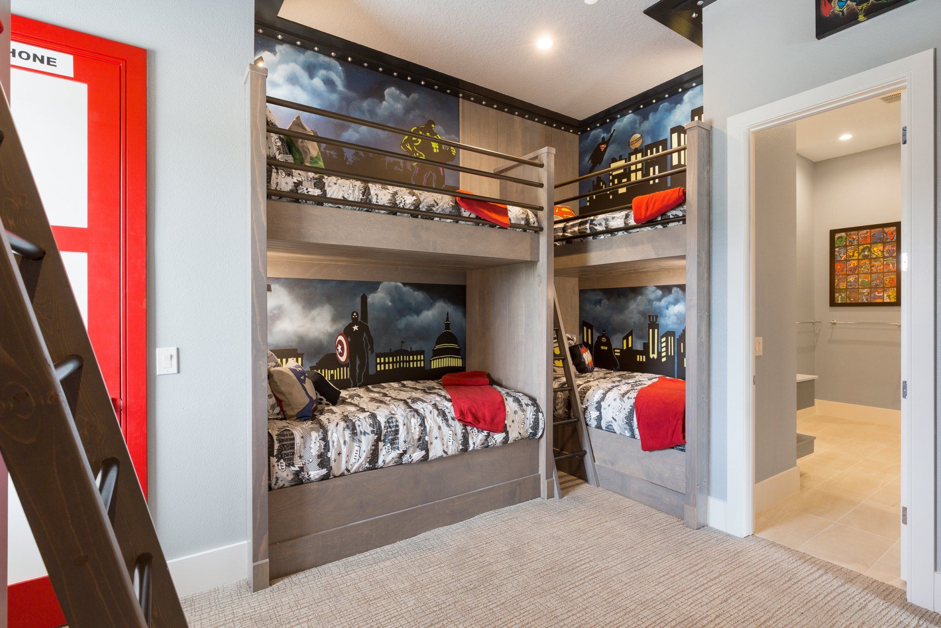 a bedroom with two bunk beds and a ladder