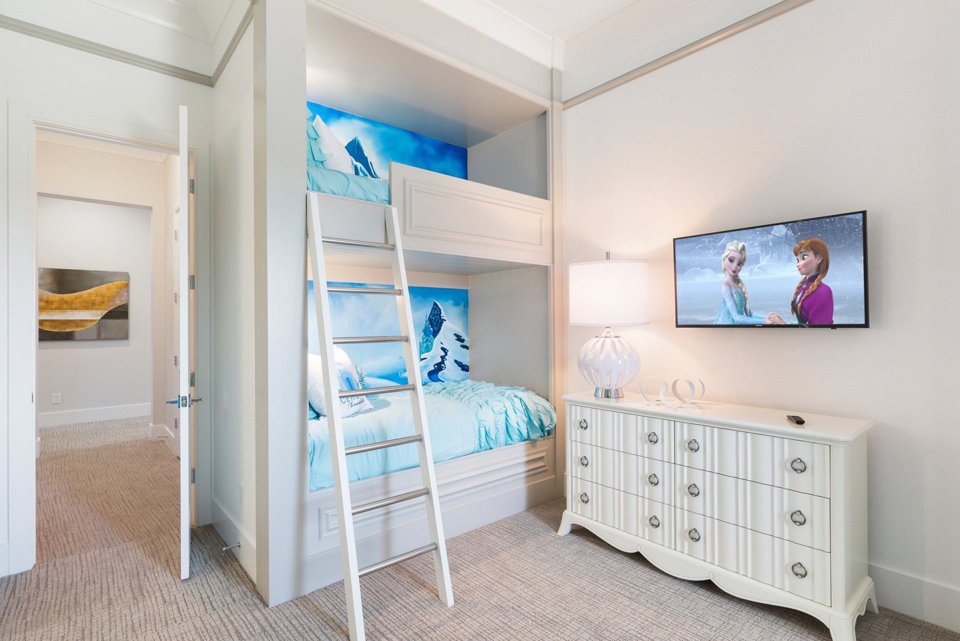 a bedroom with a bunk bed and a flat screen tv