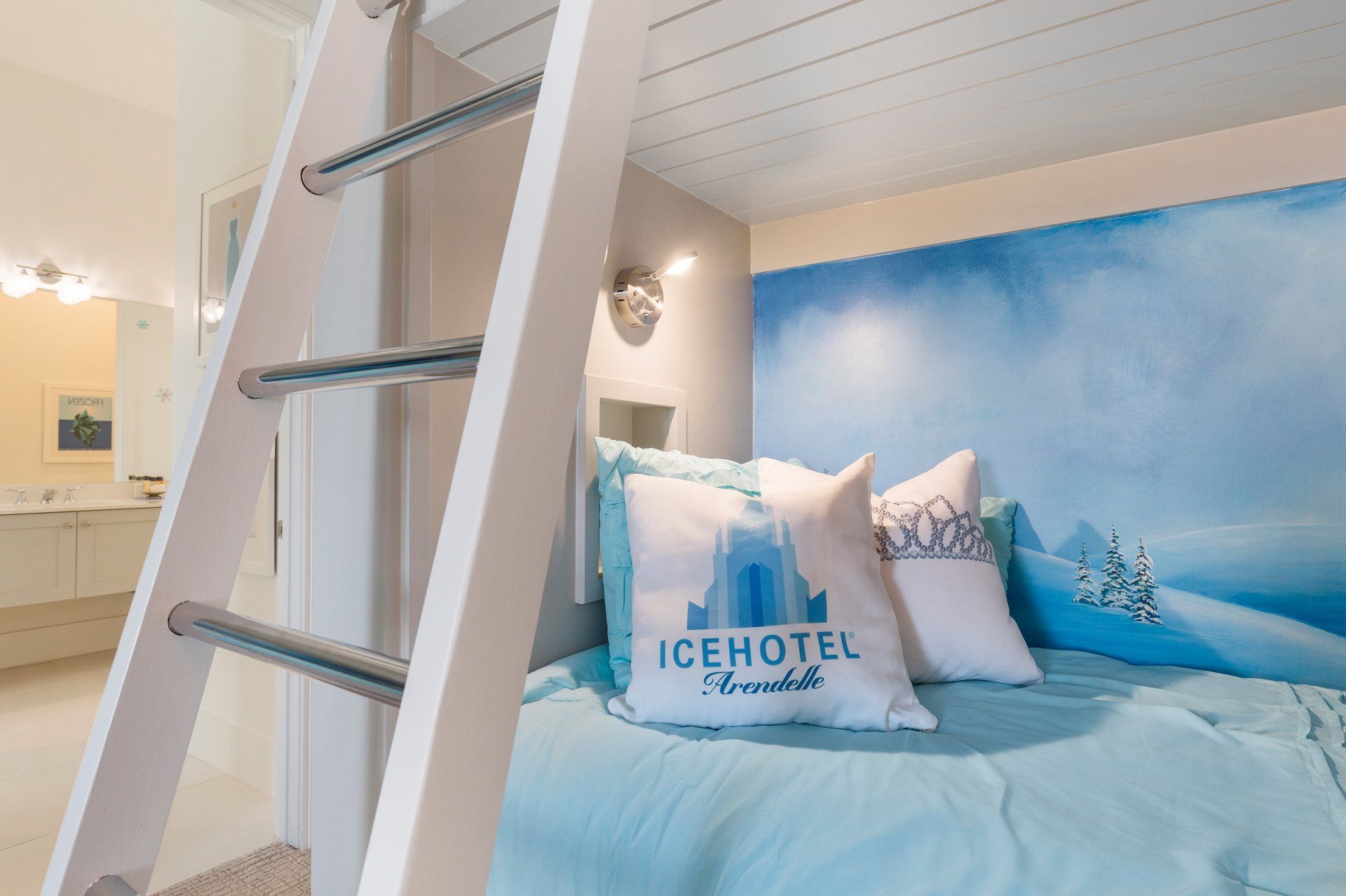 a bedroom with a bunk bed and a ladder