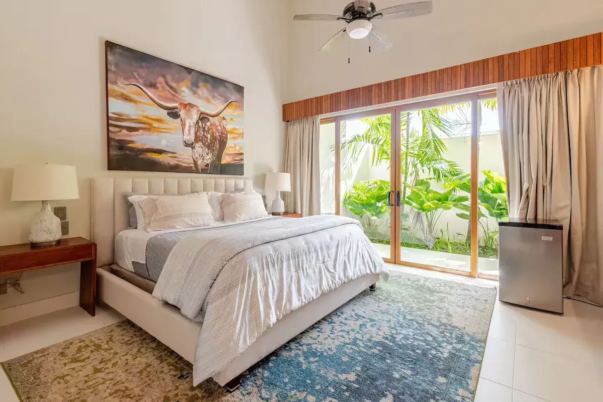 a bedroom with bunk beds and a flat screen tv