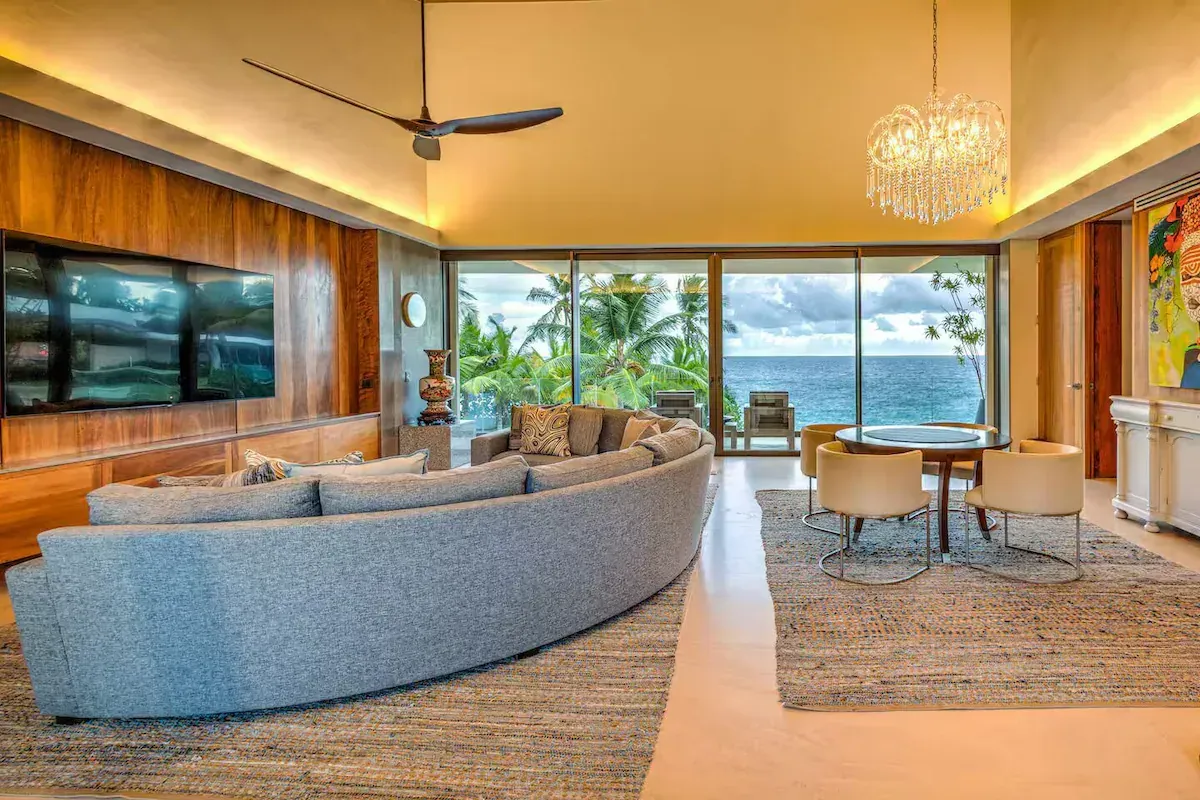 a living room with a couch and a mural on the wall