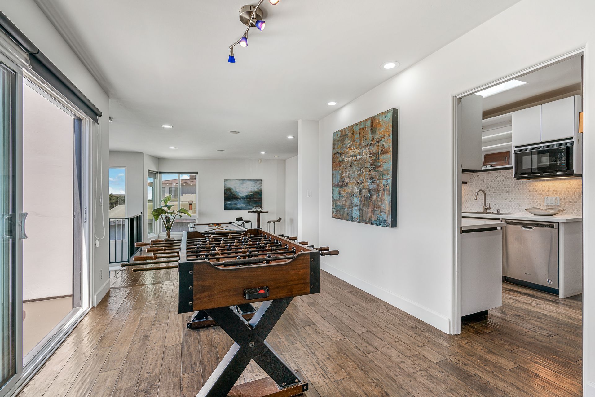 There is a foosball table in the middle of the room.