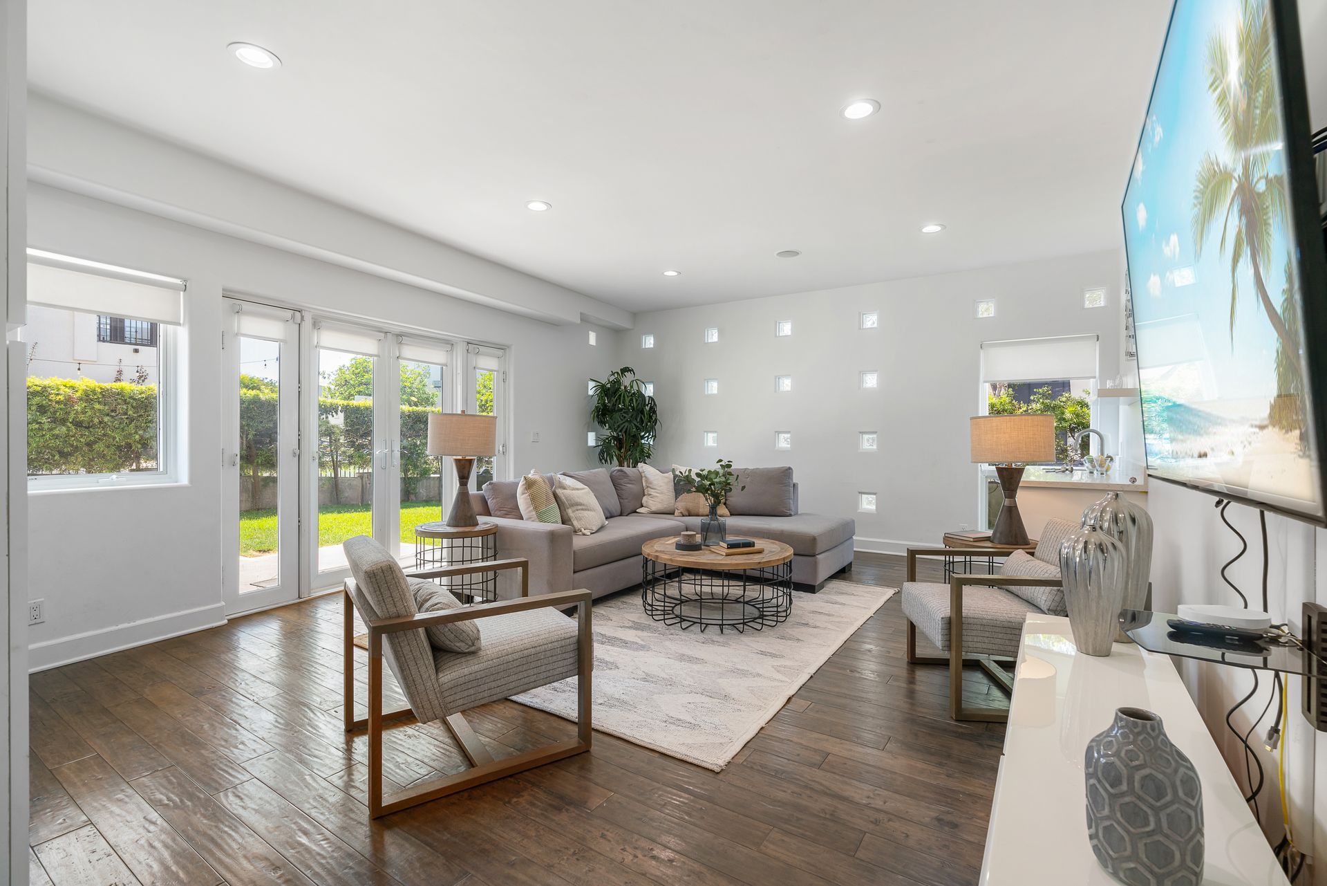 a living room with a yellow couch and a fireplace