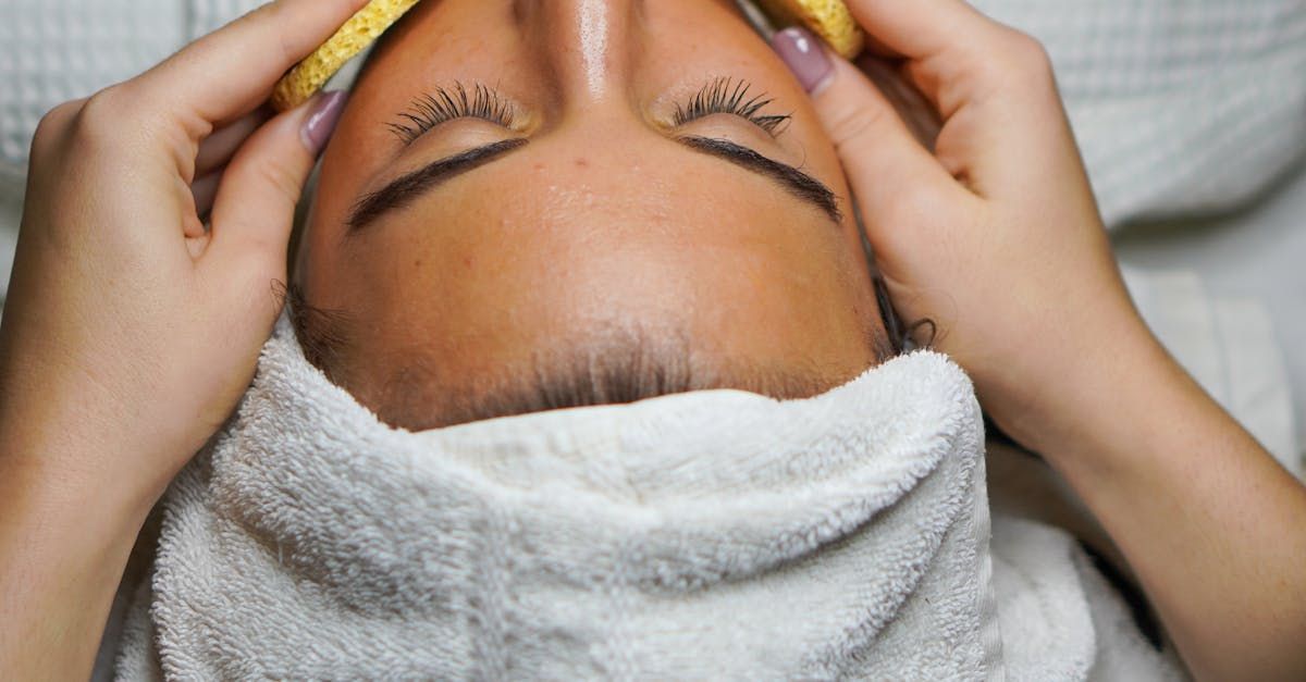 A woman is getting a facial treatment at a spa.