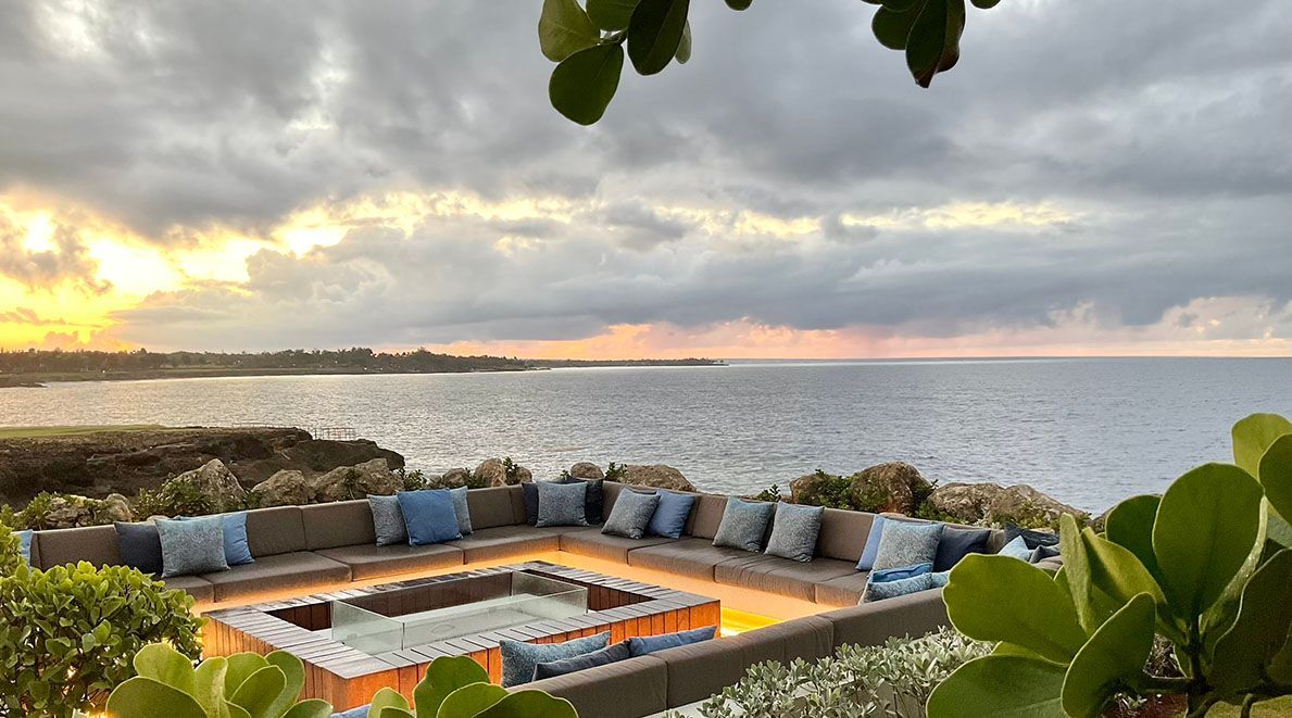 a living room with a couch, chairs, and a coffee table