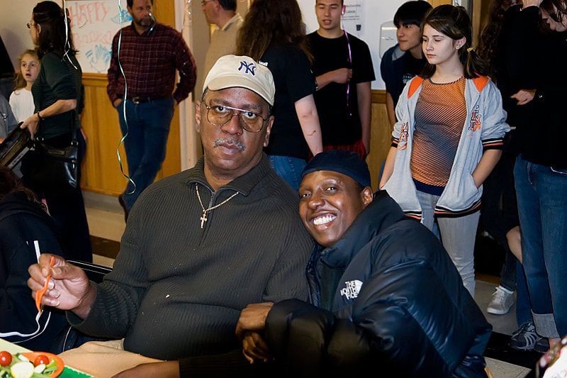 Two men seated indoors