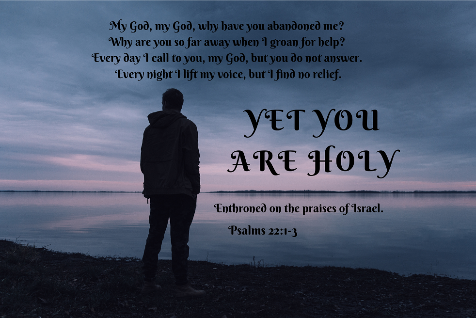 A man standing on a beach with a bible verse that says yet you are holy