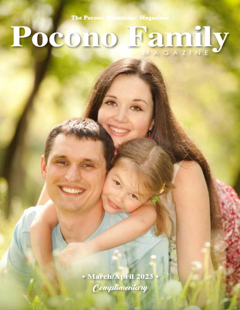 A man and woman are hugging a little girl on the cover of pocono family magazine
