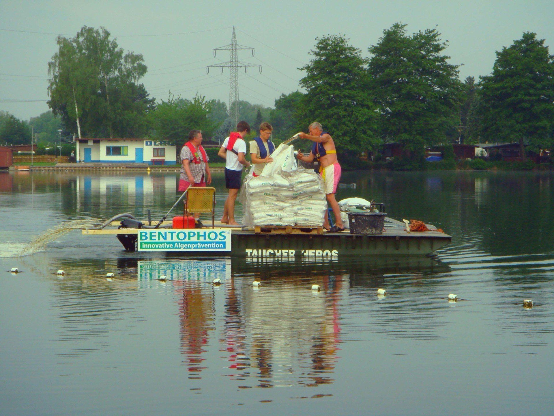 A group of people on a raft that says bertolmos on it