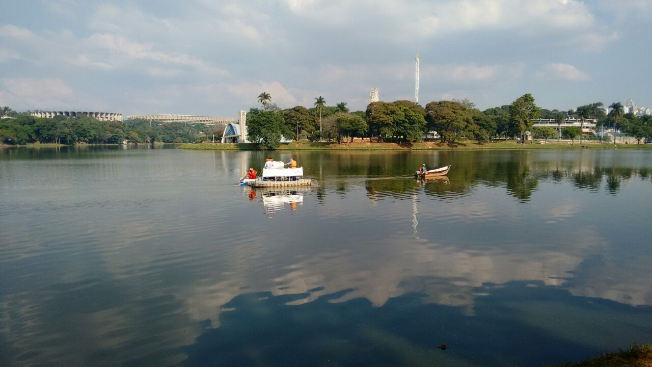 A boat is floating on top of a large body of water.