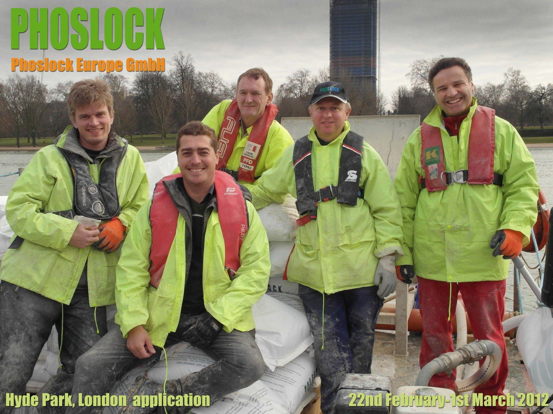 A group of men posing for a photo with the word phoslock on the bottom