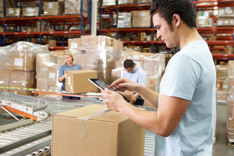 Worker checking order on a tablet