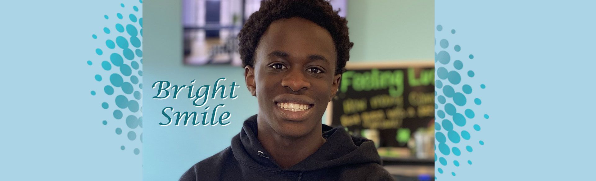 A smiling teen in black shirt, with the words “Bright Smile.”