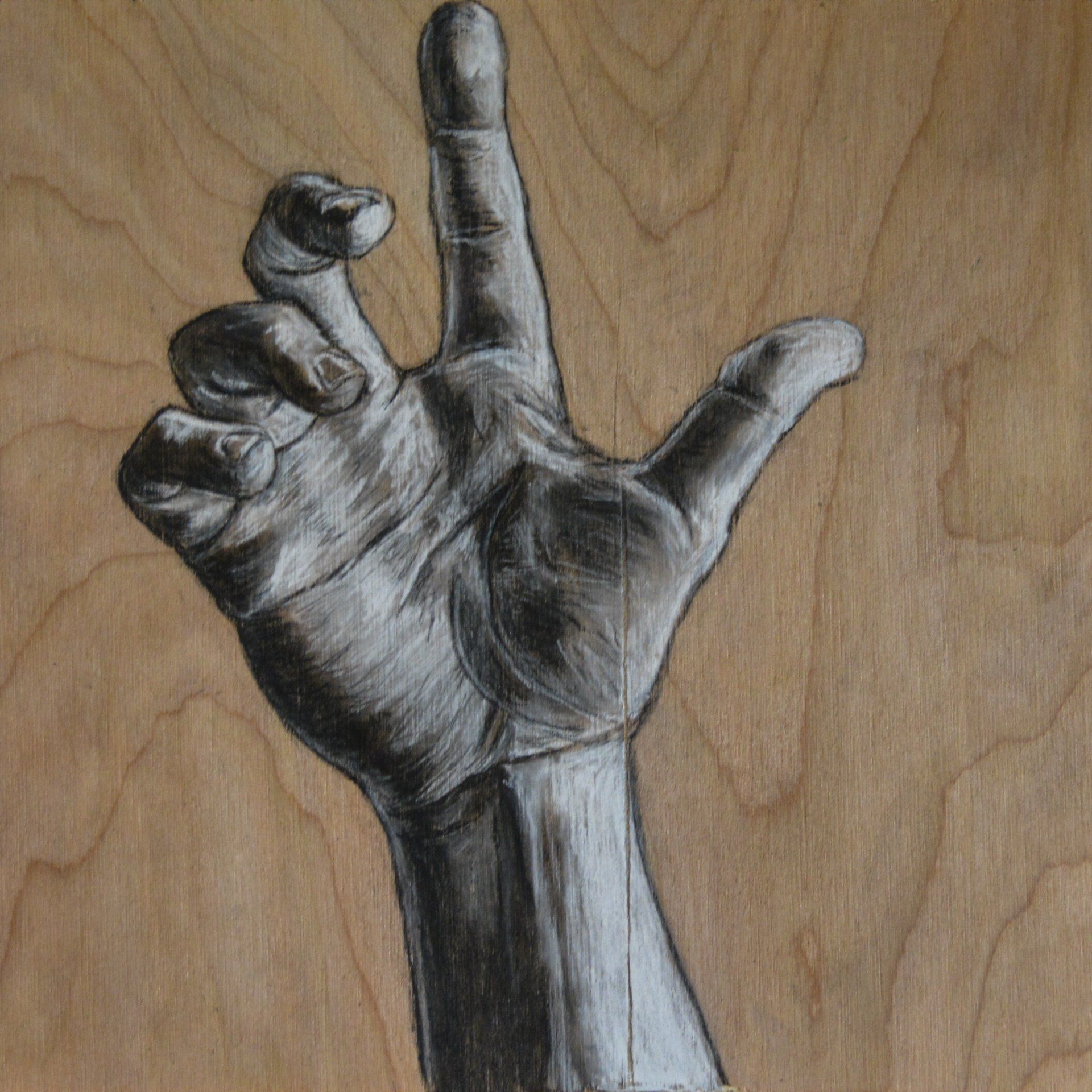 Charcoal drawing of a hand against a wood grain background, fingers up in a gesture.