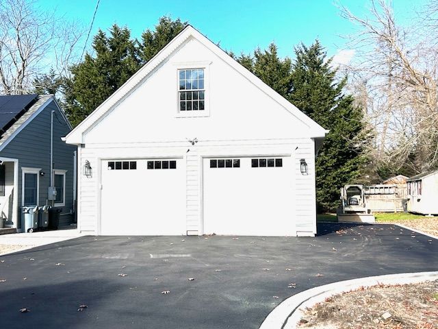 A white garage with two doors and a window