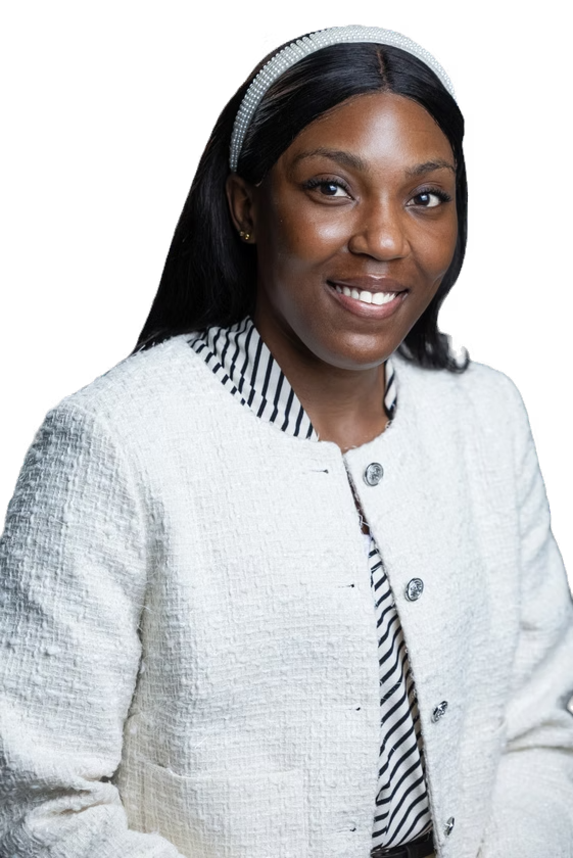 A woman wearing a white jacket and a headband is smiling.