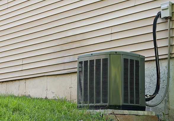 A image of HVAC unit in the yard.