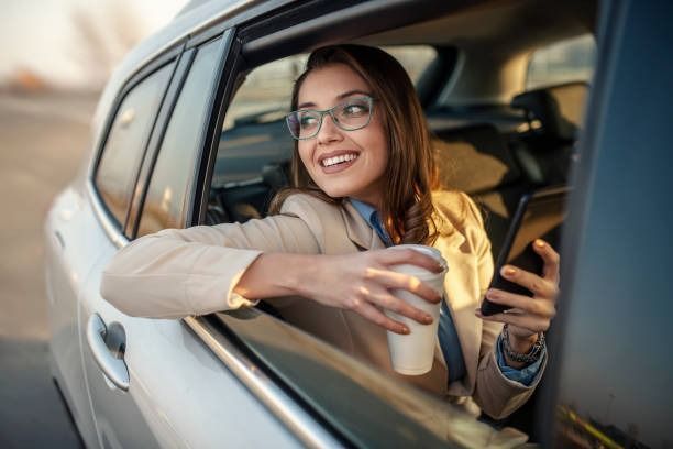 A white taxi van is parked in front of a building. — Tweed Heads Coolangatta Taxi Service In Tweed Heads, NSW