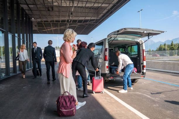 A Group of People Are Loading Their Luggage Into a Van — Tweed Heads Coolangatta Taxi Service In Tweed Heads South, NSW