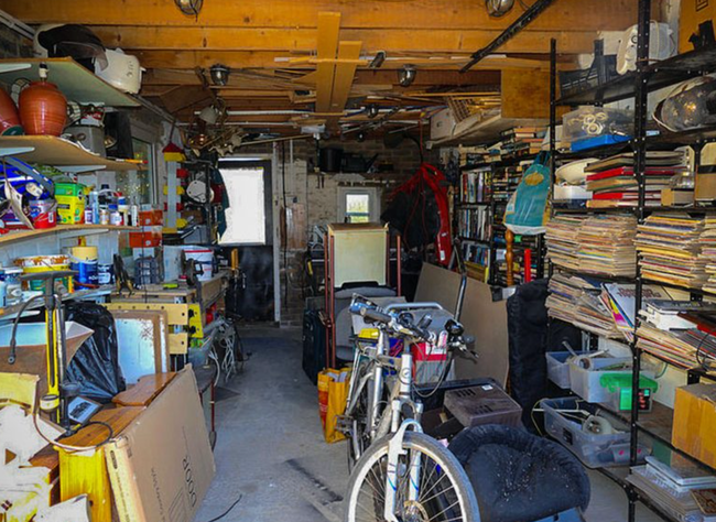 Piles of random junk inside storage unit.