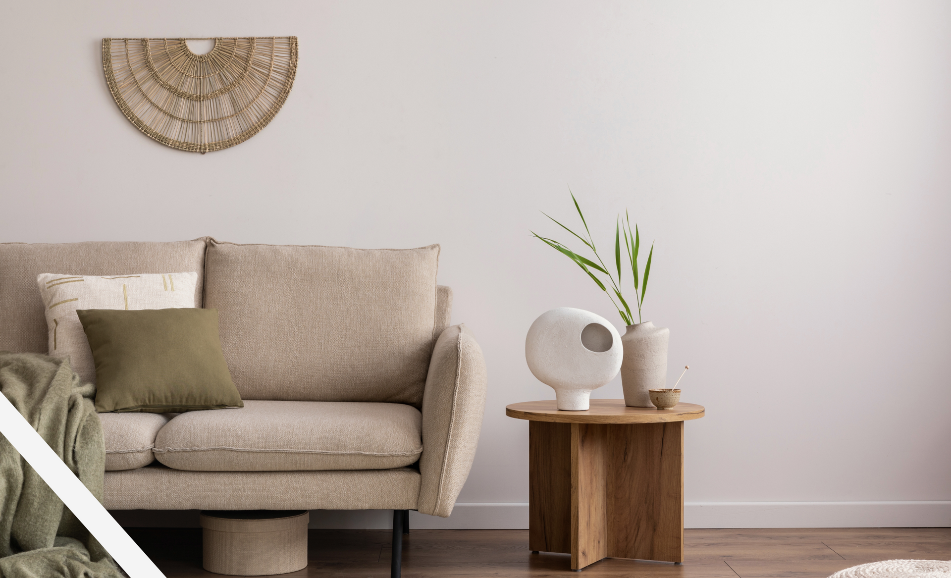 A living room with a couch and a wooden table.