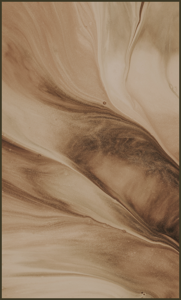 A close up of a brown and white painting on a wall.