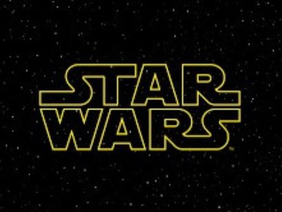 Yellow "STAR WARS" logo on a black background with white star-like dots.