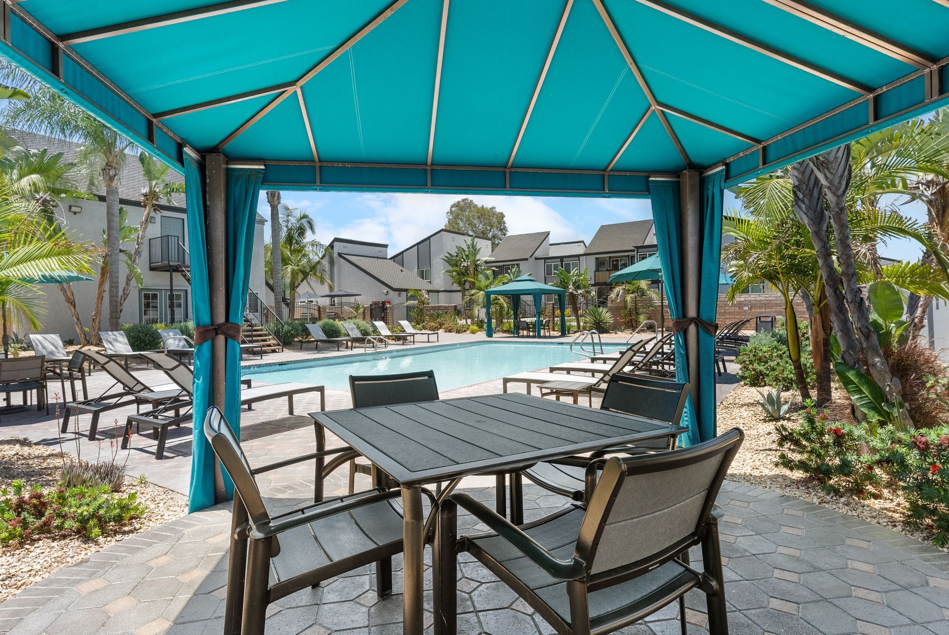 poolside cabana with table and chairs