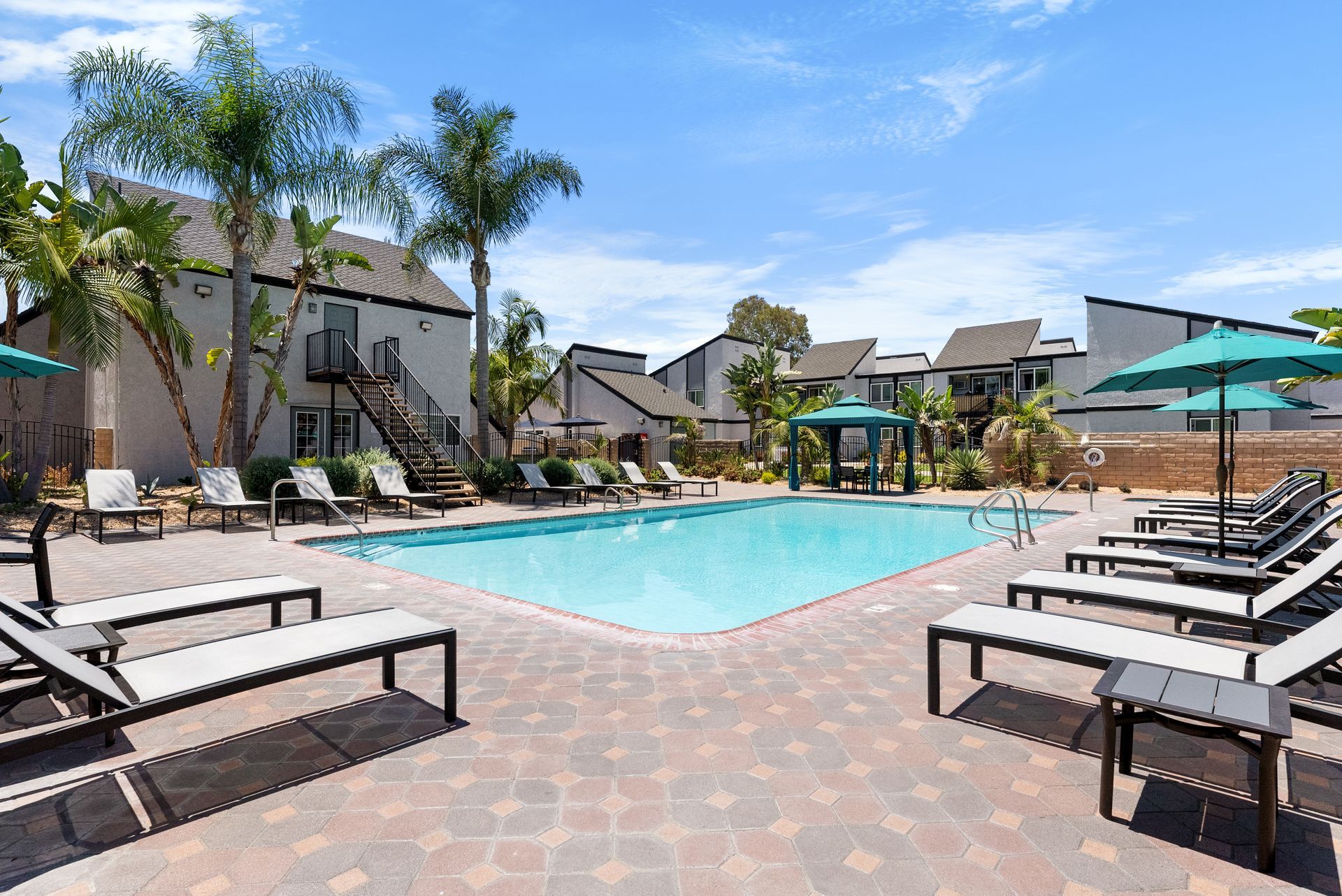 apartment pool and lounge chairs
