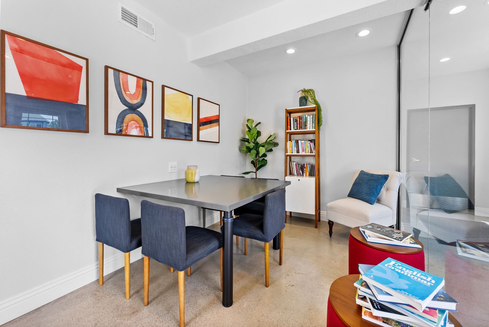 lounge with chairs, table, and books