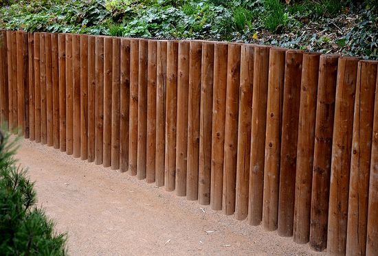 wood retaining walls beside the walkway