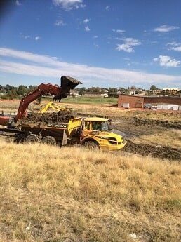tractor loads dirt - construction in WY
