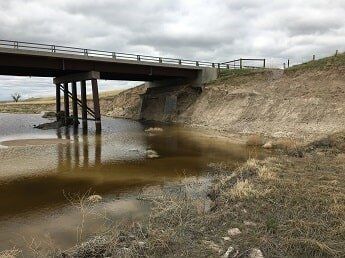 flooding under bridge - commercial construction in WY