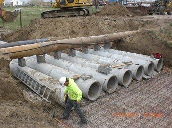 lining up drain pipes - construction in WY