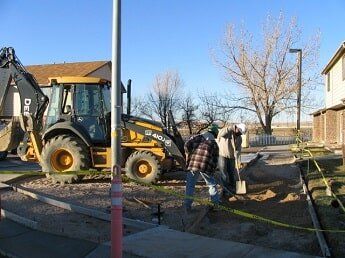 workers digging in dirt - commercial construction in WY