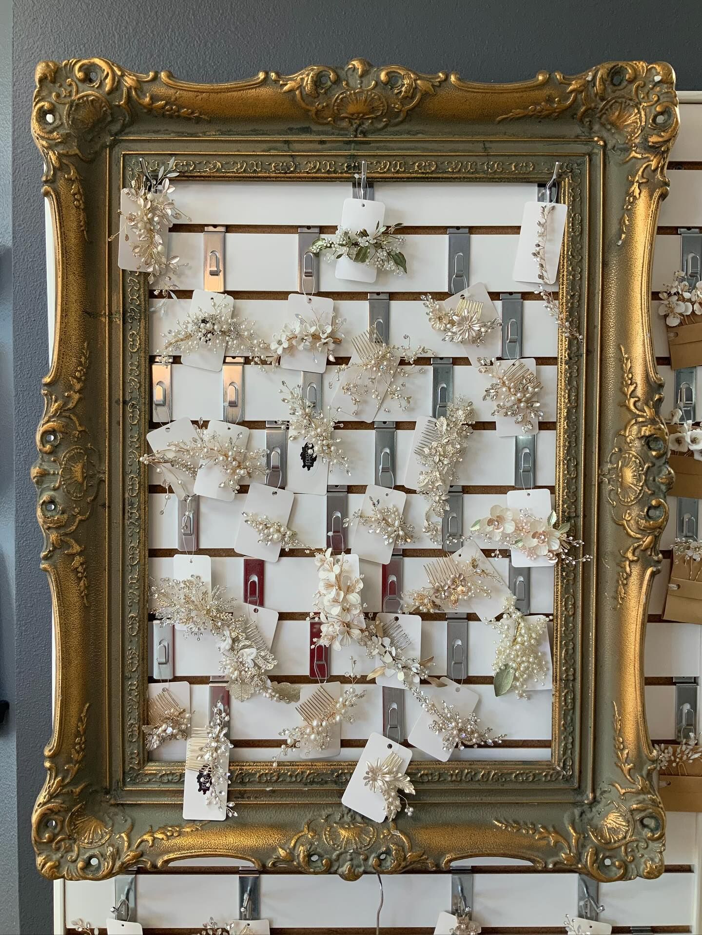 Green plant cuttings in a clear glass jar filled with water, against a white background.