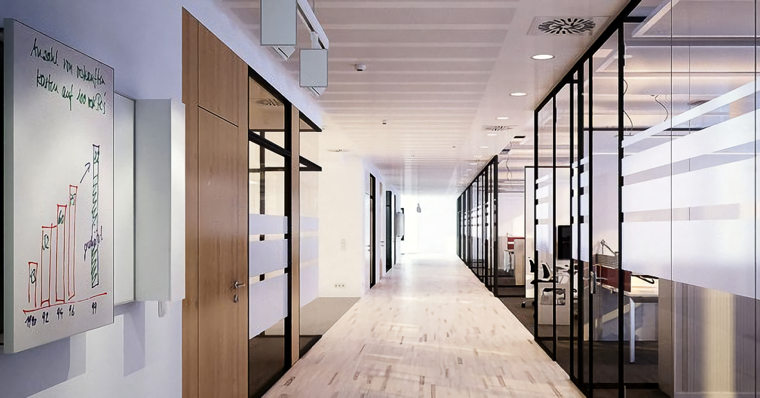 An artist 's impression of a long hallway in an office building.