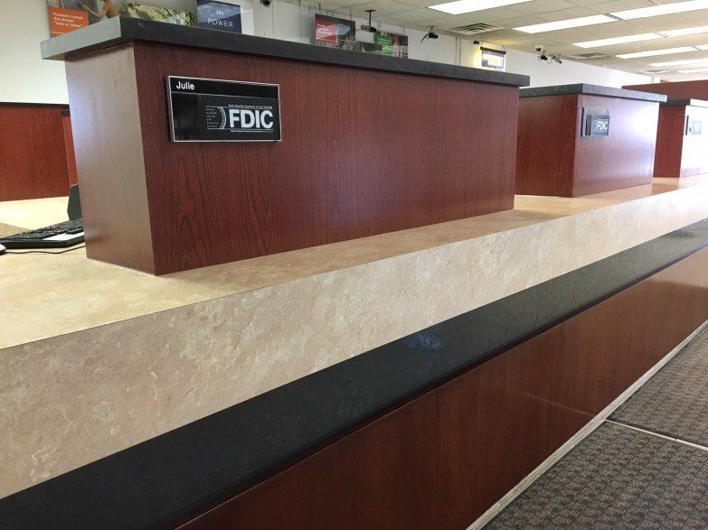 A wooden counter with a sign that says fdic on it