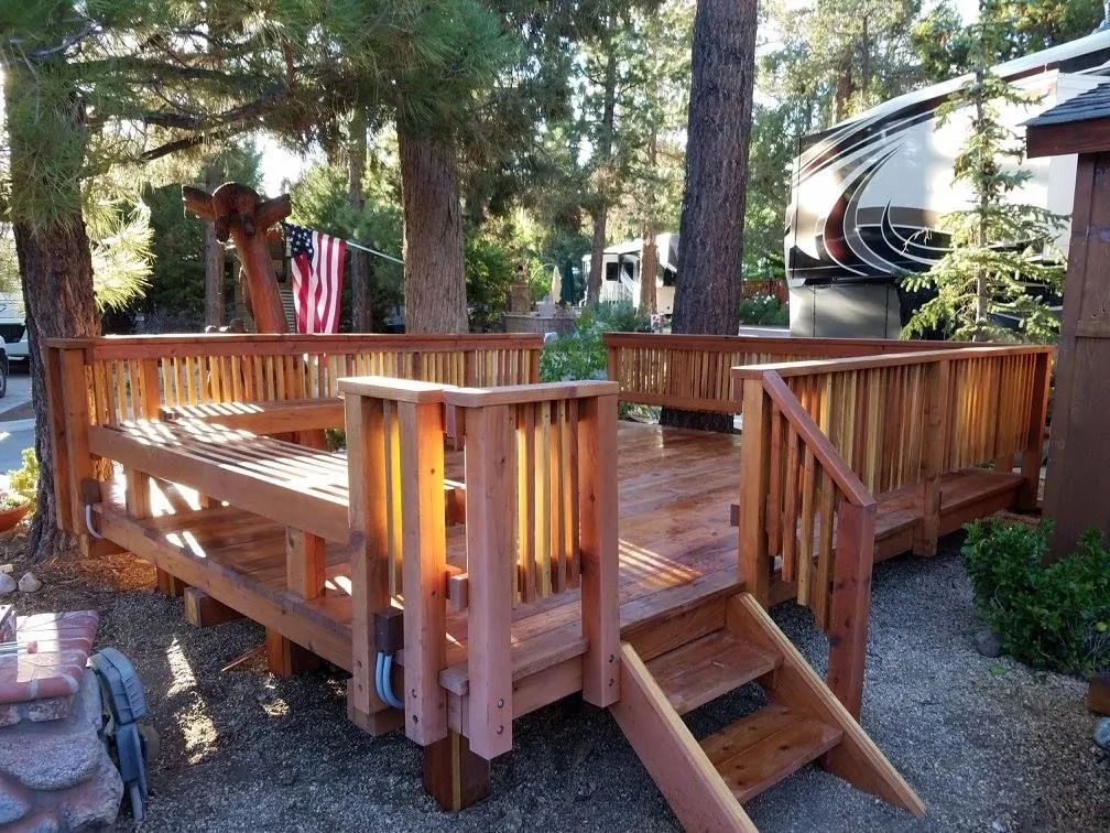 A large wooden deck with stairs leading up to it