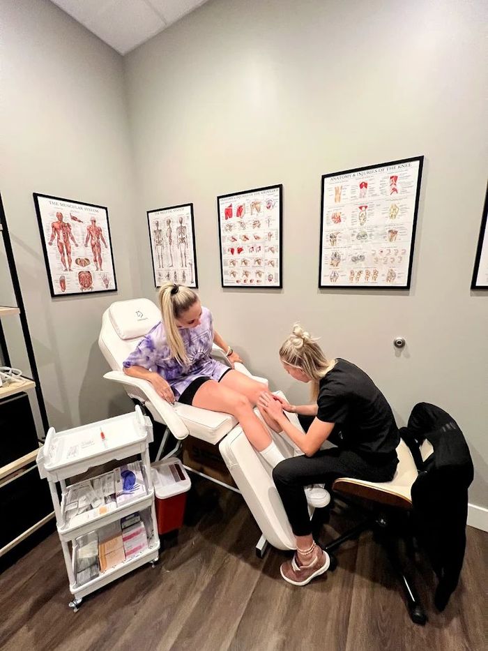 Aubrie Bair, DNP, FNP-BC in a consultation with a female patient.