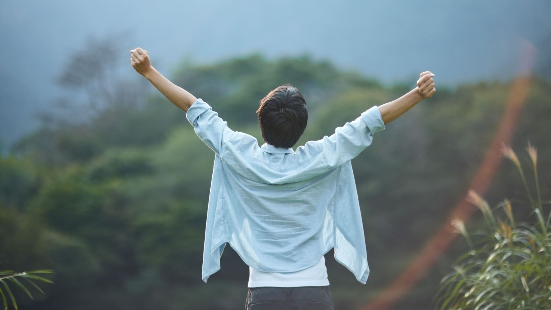 A picture of a person outdoors enjoying themselves.