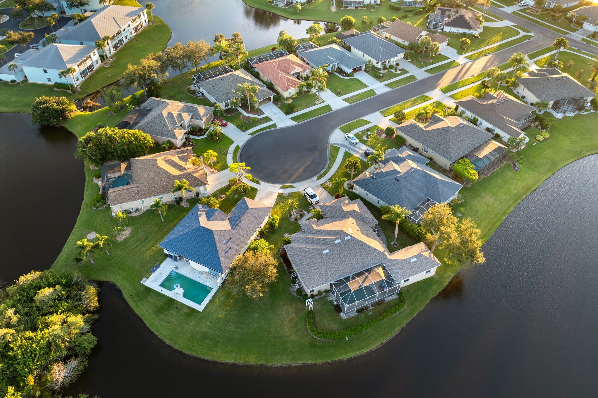 Model house under construction, with tiny figures working on blueprints.