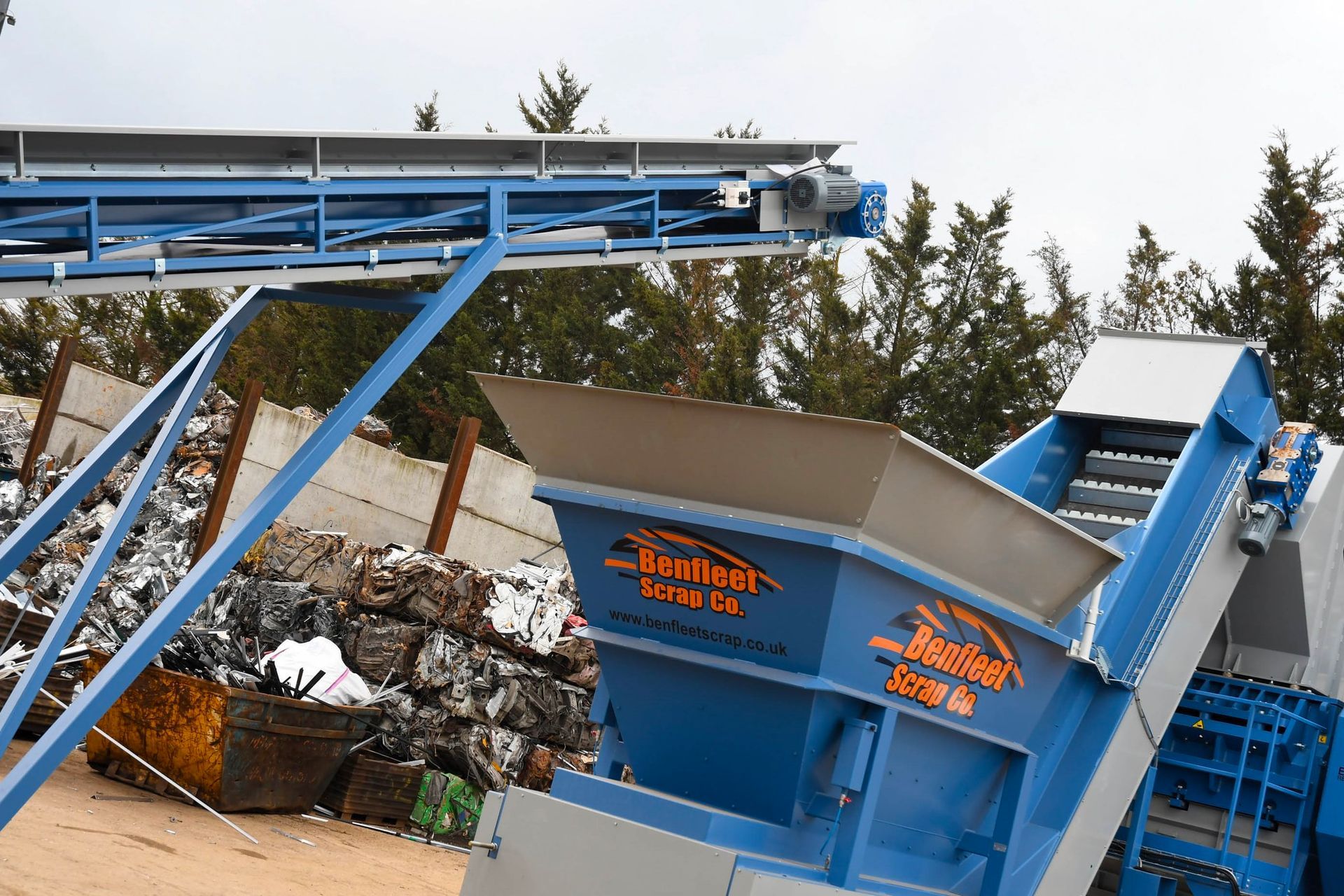 A conveyor belt is going through a pile of scrap metal at Benfleet Scrap.
