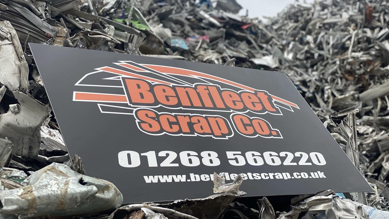 Benfleet Scrap Co logo on board on scrap heap in scrap yard